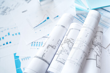 Business project documentation, development, planning and approval. Construction drawings for building, apartment, financial diagrams, investment plan, documents. Making repairs. Blurred background