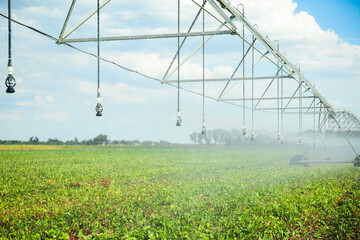Center pivot irrigation system watering agricultural field
