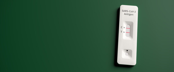 Quick testing for Covid-19 / SARS-CoV-2 infection concept: One rapid antigen test kit showing a positive result (two lines)