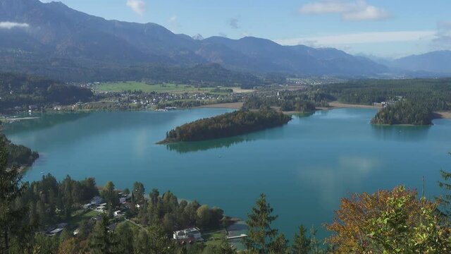 autumn view of austrian lake Faakersee from the viewpoint at the sunny october day
