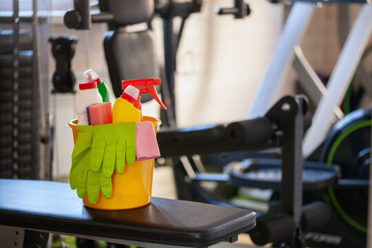 Spring cleaning in the home gym. Bucket with cleaning facilities