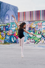 Fototapeta na wymiar Young Girl Ballet Dancer in Urban Street Wynwood Florida