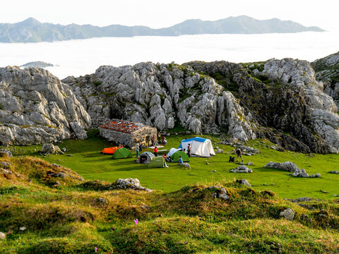 Camping in the Mayada de Tord&iacute;n, in the Picos de Europa National Park: in the background the profile of the Sierra del Cuera (Asturias / .