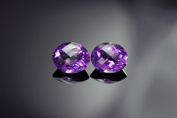 Natural brazilian oval checker faceted  purple amethyst gemstones pair. Rich violet color, clean, transparent, flawless stone settings for making earrings or any king of jewelry.