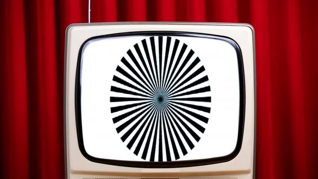 retro television with technical patternes against velvet curtain
