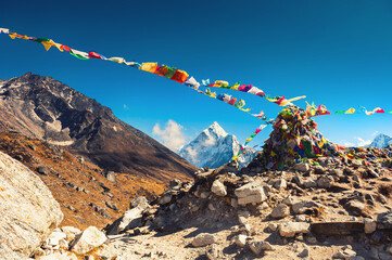 Colorful prayer flags on Thokla pass, Everest Base Camp trek in Himalayas, Nepal. Khumbu valley, Everest region, Nepal.
