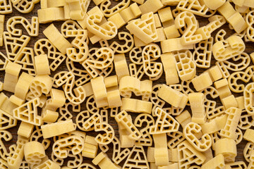 abc 123 artisanal pasta on wood, background and texture