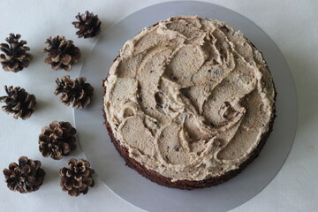 Chocolate cake with vanilla butter icing mixed with chocolate as the topping.