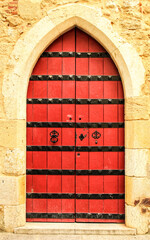 Old and colorful wooden door with iron details