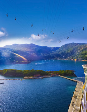 People Flying At High Zipline On Caribbean