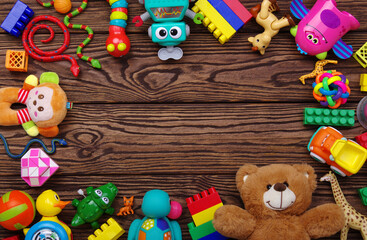 Fototapeta na wymiar Toys colored and top view with copy space on wood