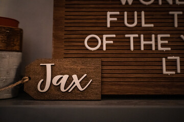 Wooden Christmas ornament with the name "Jax"