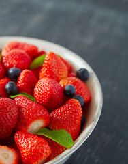fresh strawberries in a ceramic bowl