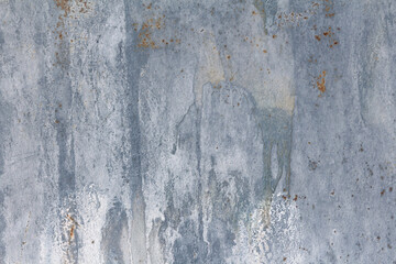 Gray dirty wall with old paint and  chemical  stains