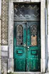 Old and colorful wooden door with iron details
