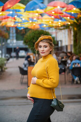 pregnant woman walking in the street