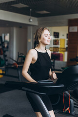 Fototapeta na wymiar Girl doing exercise in the gym. Sport, healthy lifestyle concept