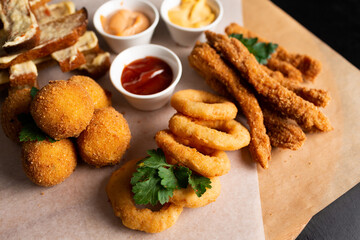 a large plate with a wide selection of snacks for beer