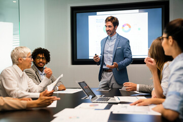 Collaboration and analysis by business people working in office