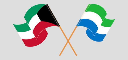 Fototapeta na wymiar Crossed and waving flags of Kuwait and Sierra Leone