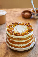 Banana cake with caramel. Wooden background, side view.