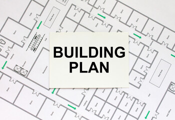 Business card with text Building Plan on a construction drawing