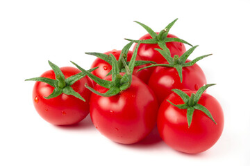 Ripe red cherry tomatoes isolated on white. Cocktail tomatoes with green plant stems