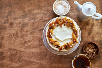 Banana cake with caramel. Wooden background, top view.