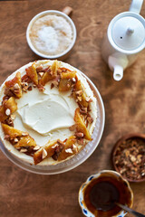 Banana cake with caramel. Wooden background, top view.