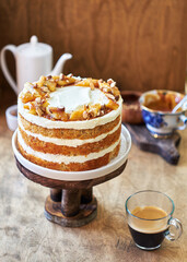 Banana cake with caramel. Wooden background, side view.