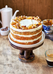 Banana cake with caramel. Wooden background, side view.