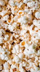 Texture of spilled popcorn. Snack for watching a movie.