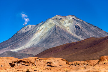 Bolivia, Potosi Department. Smoky fumarole of Ollague volcano on the border between Bolivia and...