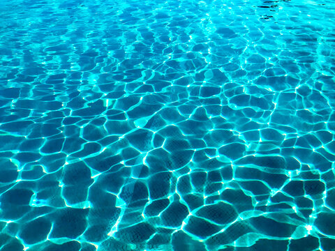 Pattern Formed By Rippling Water On An Outdoor Swimming Pool. No People.