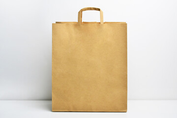 Kraft brown paper shopping bag. Paper shopping bag on white background. Brown paper craft bag...
