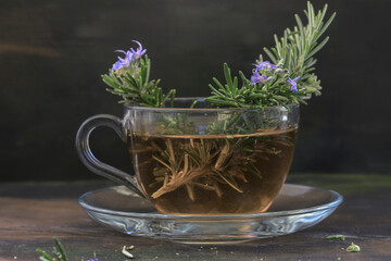Fresh rosemary tea in glass cup ; Rosmarinus