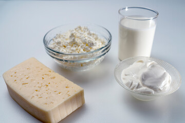 still life with dairy products cottage cheese, sour cream and yogurt on a white background