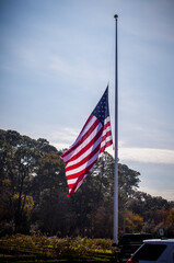 American flag flying at half-staff.