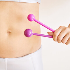 Young woman hand holding femine sex toys. Kegel adult exercise. Intimate gymnastics. Recovery vagina pain. Light background. Gynecology health ball. Health stomach