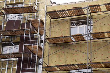 Thermal insulation of a multi-storey building with special materials.