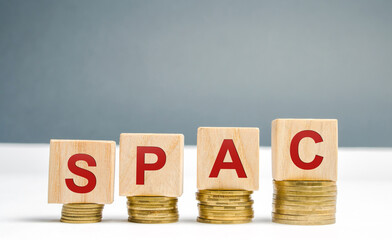 Wooden blocks with the word SPAC - Special purpose acquisition company. Simplified listing of...