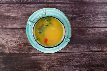 Carrot soup on a wooden table