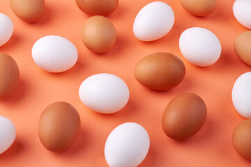 Group of white and brown raw chicken eggs.