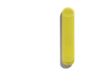 Disposable e-cigarette in yellow color on white isolated background. The concept of modern smoking, vaping and nicotine. Top view