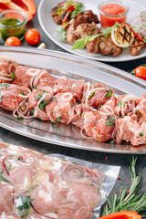 marinated meat for barbecue. vacuum-packed and marinated meat, meat on a skewer and ready-made grilled meat with sauce on a plate