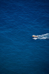 Obraz premium Beautiful view to boat in blue Mediterranean in Ravello, Amalfi coast, Italy in summer.