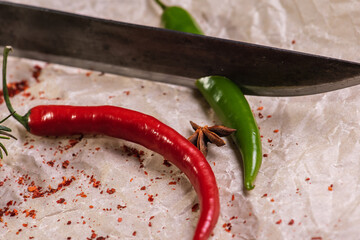 Assorted peppers and spices on a light parchment background. Seasonings for food. Homemade spices...