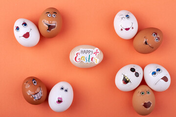 Happy easter congratulation. White and brown chicken eggs with funny smiley face.
