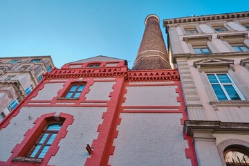 Old vintage building, bakery furnace chimney and kiln shaft extends to blue sky in istanbul.