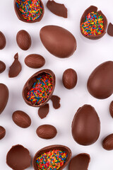 Vertical shot of choco eggs with rainbow sprinkles filling.